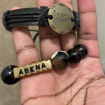 Rainbow Restaurant - a person's hand holding two bracelets - African Near Me - Gaithersburg, Maryland