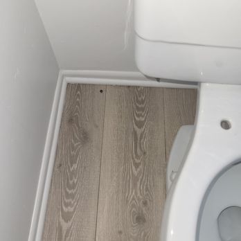 FW House Cleaning - Obvious dirt behind the toilet, they didn't remove toilet seat, I did to replace. - Home Cleaning Near Me