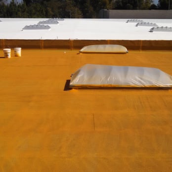 Royal Roof Construction - White roof in far background shows the finish, hot mustard area is a coating. Royal also replaced all 18 skylights for us! - Roofing Near Me - Placentia, California Royal Roof Construction - White roof in far background shows the finish, hot mustard area is a coating. Royal also replaced all 18 skylights for us! - Roofing Near Me - Placentia, California