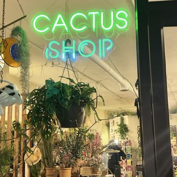 The Brass Hand - Hanging Neon Welcoming Sign to the Invite and Peak your interest in the Shop. - Home Decor Near Me - Columbus, Ohio The Brass Hand - Hanging Neon Welcoming Sign to the Invite and Peak your interest in the Shop. - Home Decor Near Me - Columbus, Ohio