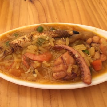 Pulpería Noray - Tapa of yellow rice with seafood. Absolutely delicious. - Galician Near Me - Granada, GR