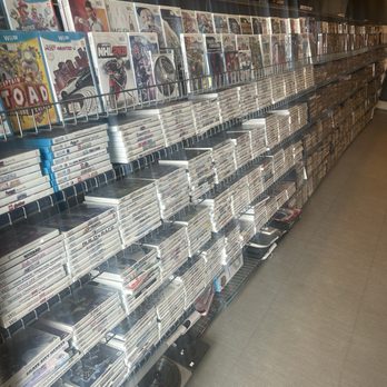 Game Plus - Big selection of kids/Wii console games! - A retail shelf holds numerous Wii and Nintendo Switch game cases, organized in rows, with some titles visible. The store appears to specialize in video games and accessories. - Video Game Stores Near Me - Broomfield, Colorado