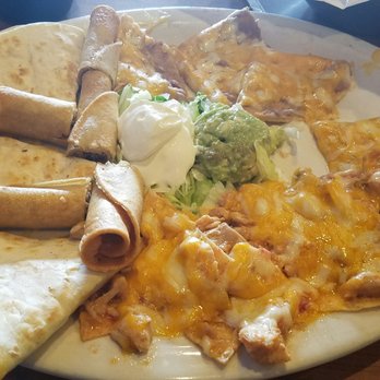 El Nino Mexican Restaurant - The sampler. Both the bean and chicken nachos were soggy when they arrived. - Mexican Near Me - Harrah, Oklahoma