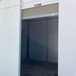 Storage unit with water stained floor. Storage unit with water stained floor.