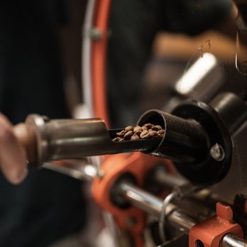 Imua Coffee Roasters - a person roasting coffee beans - Coffee & Tea Near Me - Kapaa, Hawaii