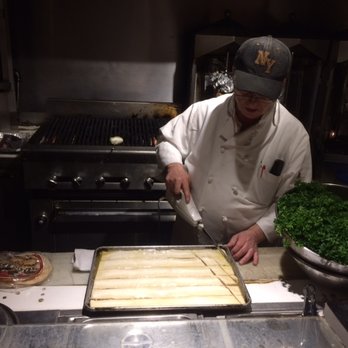 Marouch Restaurant - Owner Serge Brady does the final bit of carving before the baklava goes into the oven. - Armenian Near Me - Los Angeles, California Marouch Restaurant - Owner Serge Brady does the final bit of carving before the baklava goes into the oven. - Armenian Near Me - Los Angeles, California