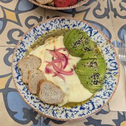 Ojo De Agua - Swiss enchiladas with cheese and avocado.