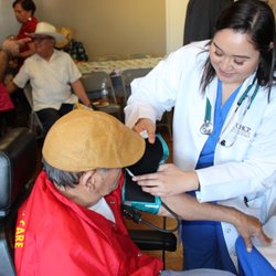The College of Health Care Professions - Hands-on practice at a local health fair for senior citizens.