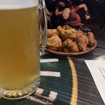Hooters - Lemon pepper and cajun wings paired with a great white brew - Sports Bars Near Me - Rohnert Park, California