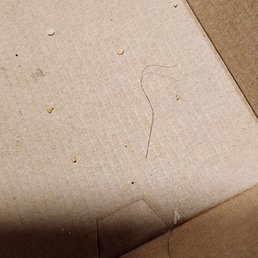 a close up of a pizza box