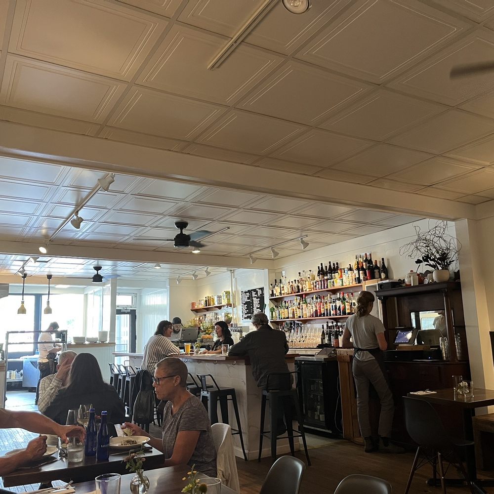 EIGHTYMain - people sitting at tables in a restaurant - Italian Near Me - Delhi, New York EIGHTYMain - people sitting at tables in a restaurant - Italian Near Me - Delhi, New York