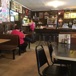 people sitting at tables in a restaurant people sitting at tables in a restaurant
