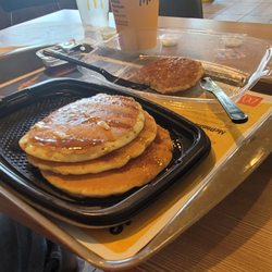 McDonald's - Thank you for the soft butter spread on nice and easy syrup on sausage off to the side like I like it ready to throw it down the gullet