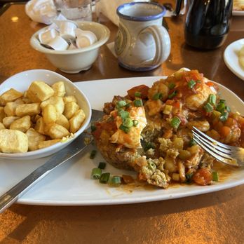 Another Broken Egg Cafe - Creole Shrimp Benedict with side of potatoes. - Breakfast & Brunch Near Me - Pensacola, Florida