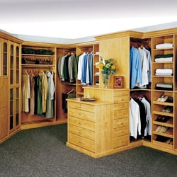 Photo of Closet World - Whittier, CA, US. Signature Deluxe walk In closet with peninsula in a Candlelight finish Melamine.