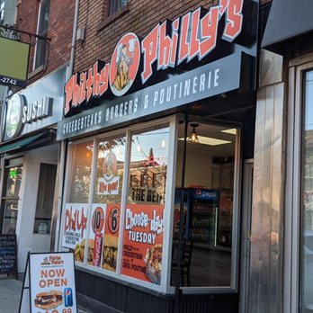 Philthy Philly’s - The store from the sidewalk to the East looking west. Aug 2022 - Poutineries Near Me - Toronto, Ontario