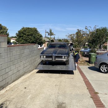 Howard's Towing - 69 Pontiac being loaded - Towing Near Me