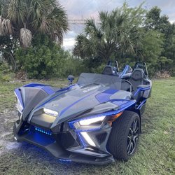 City Slingshot Rentals - Slingshot during the late afternoon hour at sunset. LEDs on.