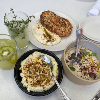 Aba - Whipped Feta, Classic Hummus, Jerusalem Everything Bagel with Labneh, Mediterranean Mule, and Kiwi drink - Mediterranean Near Me - Chicago, Illinois Aba - Whipped Feta, Classic Hummus, Jerusalem Everything Bagel with Labneh, Mediterranean Mule, and Kiwi drink - Mediterranean Near Me - Chicago, Illinois