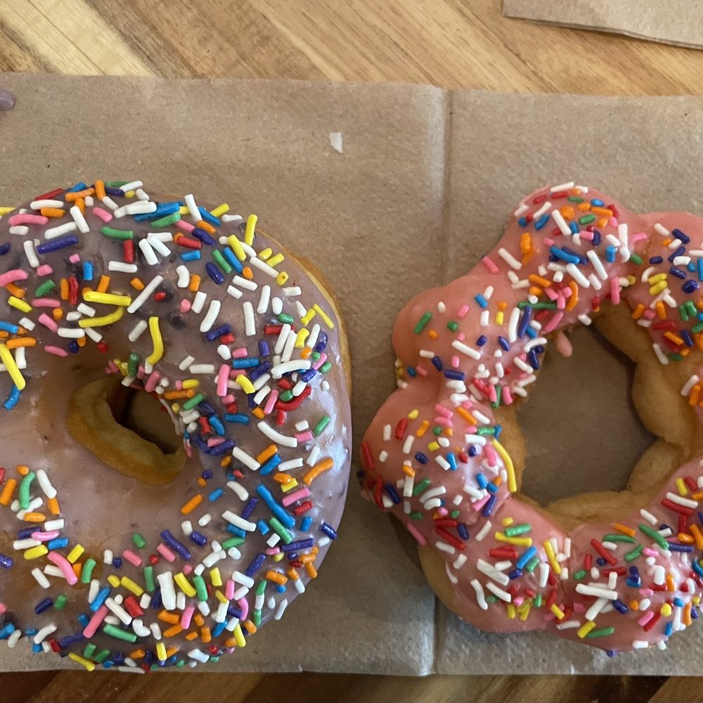Dynamite Donuts - Blueberry glazed sprinkle yeast donut, strawberry mocha sprinkle - Donuts Near Me - Hercules, California Dynamite Donuts - Blueberry glazed sprinkle yeast donut, strawberry mocha sprinkle - Donuts Near Me - Hercules, California