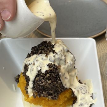 The Haggis Box - Pouring the sauce over the haggis - Scottish Near Me - Edinburgh, EDH The Haggis Box - Pouring the sauce over the haggis - Scottish Near Me - Edinburgh, EDH