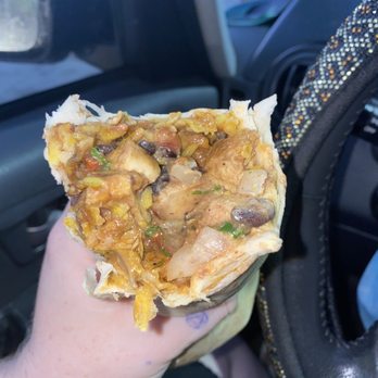 Tijuana Flats - Even more messy! Tijuana New Tijuana Queso Crunch Burrito - Tex-Mex Near Me - Valrico, Florida