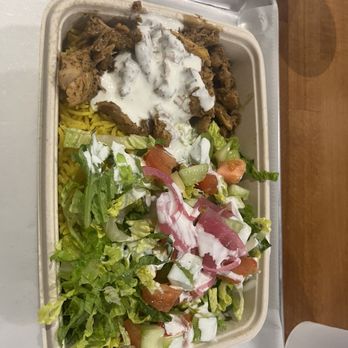 The Kebab Shop - kebab bowl with saffron rice, carved chicken, OG yogurt, romaine lettuce, sliced tomatoes, sliced cucumbers, and picked onions - Mediterranean Near Me - Georgetown, Texas