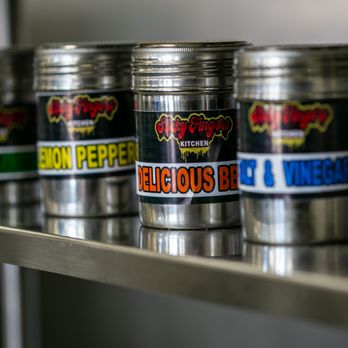 STICKY FINGERS KITCHEN - a row of metal containers on a shelf - Fast Food Near Me - Carpentersville, Illinois STICKY FINGERS KITCHEN - a row of metal containers on a shelf - Fast Food Near Me - Carpentersville, Illinois