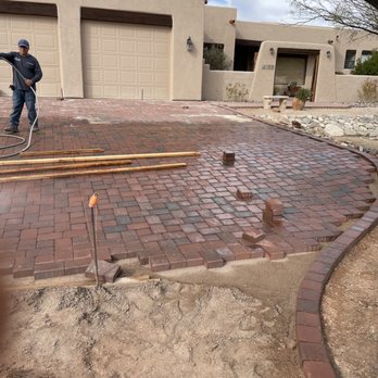 JRs Landscaping - a man working on a brick patio - Landscaping Near Me JRs Landscaping - a man working on a brick patio - Landscaping Near Me