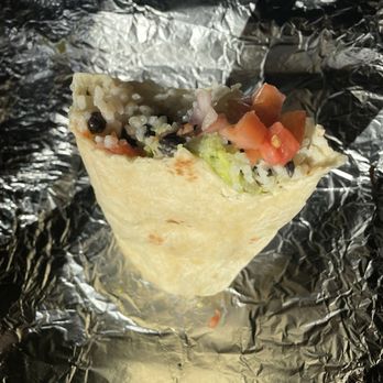 Luchador Tacos - About half way eaten "Vegarritto" (vegan burrito) - Tacos Near Me - Windham, Maine
