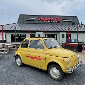 Pupatella - Outside the entrance is a social media moment with this car. - Pizza Near Me - Reston, Virginia Pupatella - Outside the entrance is a social media moment with this car. - Pizza Near Me - Reston, Virginia