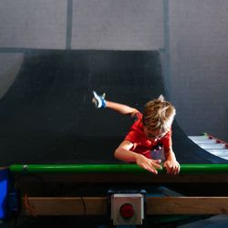 Synergy Climbing And Ninja - Hitting the timer to stop the clock during one of our ninja race events.