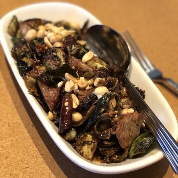 Bazille at Nordstrom - Kung pao brussel sprouts. So good and has slices of chicken sausage. - New American Near Me - Dallas, Texas