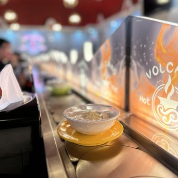 Volcano Hot Pot Carrollton - a hot pot of food on a conveyor belt - Barbeque Near Me - Carrollton, Texas Volcano Hot Pot Carrollton - a hot pot of food on a conveyor belt - Barbeque Near Me - Carrollton, Texas