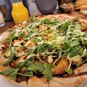 Delaney's Tavern - Roasted apple, Brie, caramelized onions, smoked sage aioli, sunny side up egg, and arugula. - New American Near Me - Orlando, Florida Delaney's Tavern - Roasted apple, Brie, caramelized onions, smoked sage aioli, sunny side up egg, and arugula. - New American Near Me - Orlando, Florida
