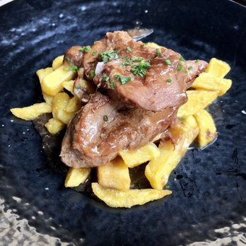 Antojo - Pork tenderloin glazed in whiskey sauce - Tapas Bars Near Me - Seville, SE Antojo - Pork tenderloin glazed in whiskey sauce - Tapas Bars Near Me - Seville, SE