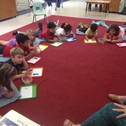 Longfellow Nursery - The first week of October, our 4's class is cutting, peeling and tasting bananas. Math (talked about what is 1/2), language arts