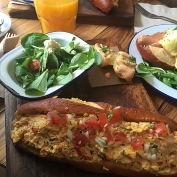 Brunch & Cake - Supersandwich with orange juice! On the side is the organic hot dog with eggs benedict and turkey - Breakfast & Brunch Near Me - Barcelona, B Brunch & Cake - Supersandwich with orange juice! On the side is the organic hot dog with eggs benedict and turkey - Breakfast & Brunch Near Me - Barcelona, B
