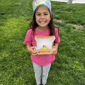 Duck Donuts - A happy birthday girl with her Duck Donut - Donuts Near Me - Rancho Cucamonga, California
