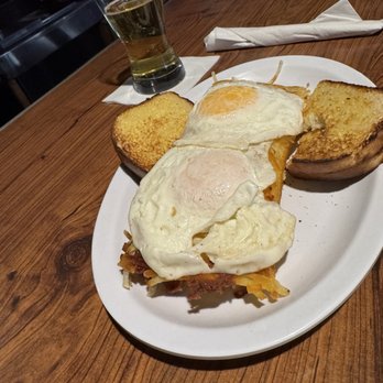 Whitlow's Forerunner - 1/2 order stuffed hash browns with 2 over easy eggs and sourdough toast - American Near Me - Muskegon, Michigan