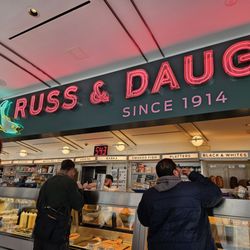 Russ & Daughters - 11th Avenue & 10th Avenue, Chelsea, Midtown West, Hell's Kitchen order counter with ticket number in background