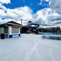 Caporella Aquatic Center - Concession stand, medium slide, and large pool