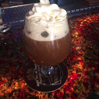 The Corner Drafthouse - After dinner Irish Coffee reflecting against the dramatic bar surface of colored crushed glass pieces under clear glass. - Gastropubs Near Me - San Diego, California