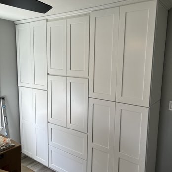 T M Construction - a room with white cabinets and a fan - General Contractors Near Me T M Construction - a room with white cabinets and a fan - General Contractors Near Me