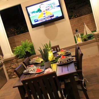 Creative Atmospheres - Outdoor living room with TV. - Landscaping Near Me Creative Atmospheres - Outdoor living room with TV. - Landscaping Near Me