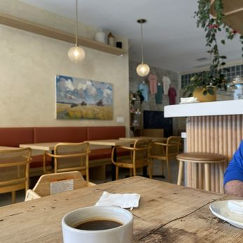 Paper Route Cafe - beaut interior with an americano - Cafes Near Me - Toronto, Ontario Paper Route Cafe - beaut interior with an americano - Cafes Near Me - Toronto, Ontario