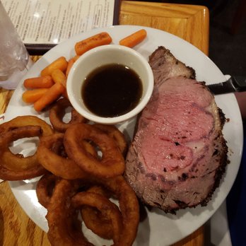 Otis & Oliver's - Prime rib special "medium rare" with onion rings and carrots - New American Near Me - Latham, New York Otis & Oliver's - Prime rib special "medium rare" with onion rings and carrots - New American Near Me - Latham, New York
