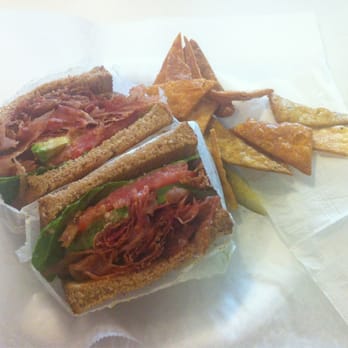 Munchie's Cafe - BLAT (bacon lettuce avocado and tomato) sandwich on wheat bread with a pickle and homemade triangle chips. - Cafes Near Me - Philadelphia, Pennsylvania Munchie's Cafe - BLAT (bacon lettuce avocado and tomato) sandwich on wheat bread with a pickle and homemade triangle chips. - Cafes Near Me - Philadelphia, Pennsylvania