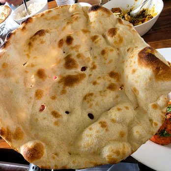 Bollywood Bistro - Naan (I always get it without ghee/butter and without them cutting it. This is the traditional way to eat it) - Indian Near Me - Fairfax, Virginia Bollywood Bistro - Naan (I always get it without ghee/butter and without them cutting it. This is the traditional way to eat it) - Indian Near Me - Fairfax, Virginia
