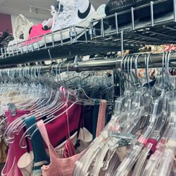 Plato's Closet - Racks of items.